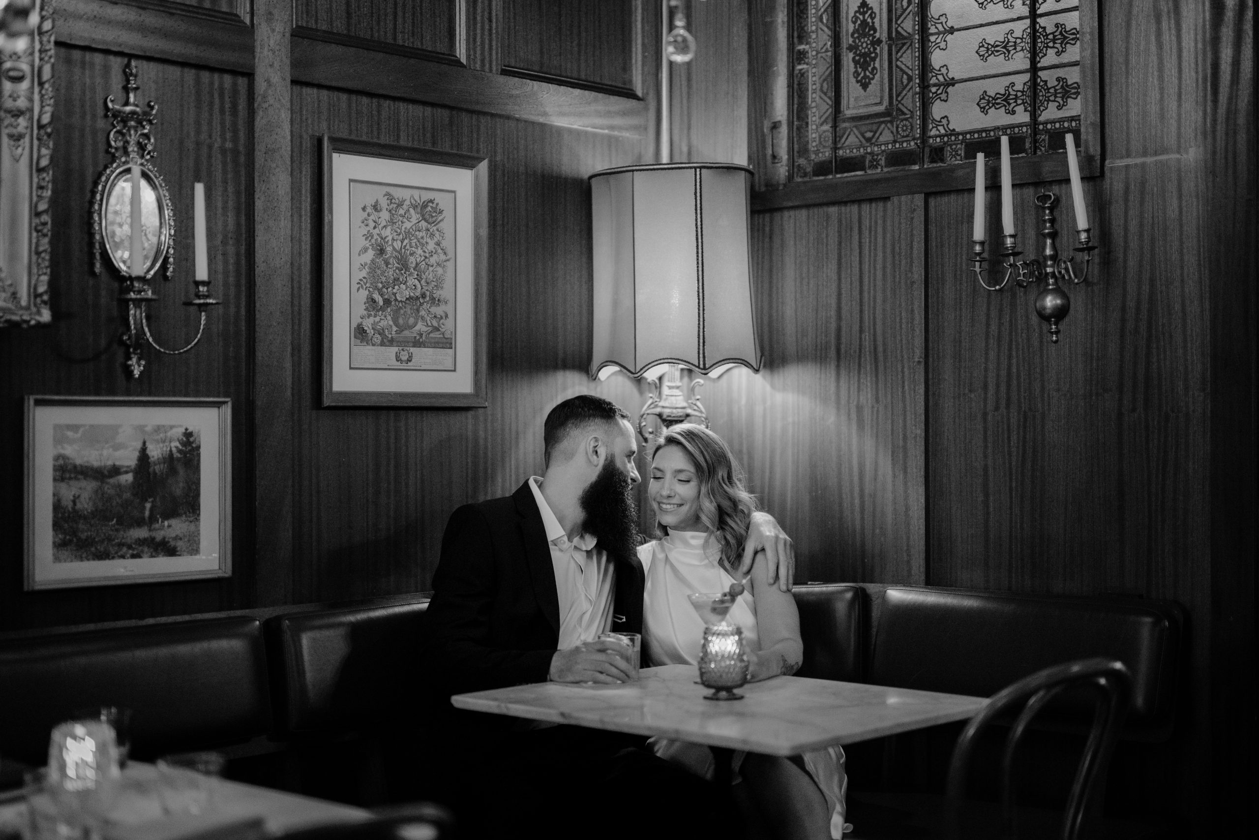 Couple sitting at their Engagement Session at Brothers Daley Sea Bright