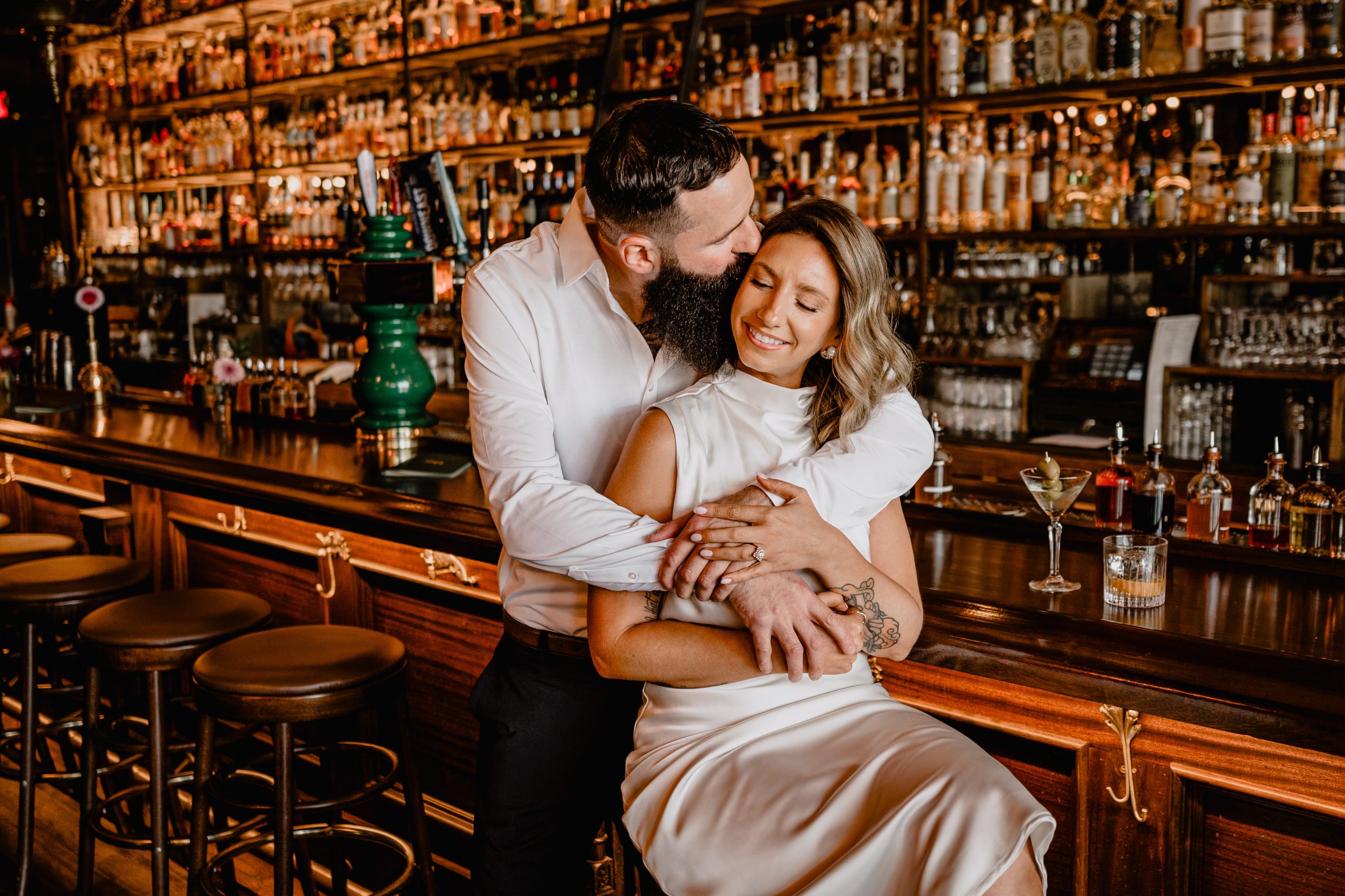 Couple by the bar at their Engagement Session at Brothers Daley Sea Bright